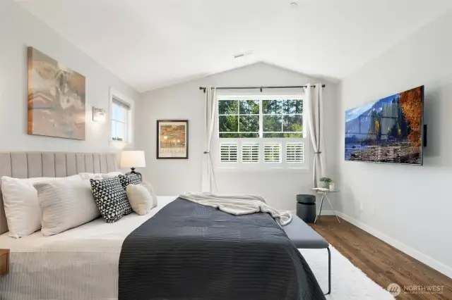 Generous primary suite with vaulted ceiling