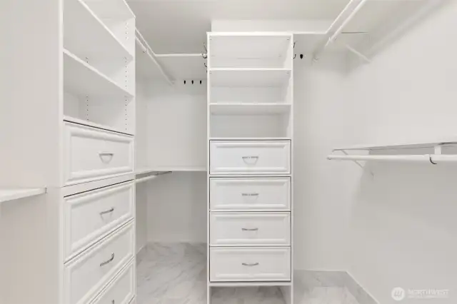 Large walk-in closet with built ins