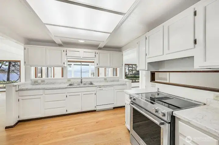 KITCHEN IS BRIGHT & BEAUTIFUL, WITH NEW LIGHTING, SINK, & FAUCET
