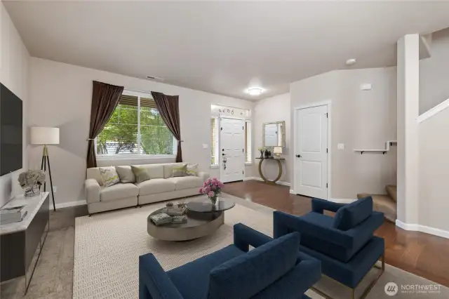 Living room greets you as you enter the home. Virtuall staged.