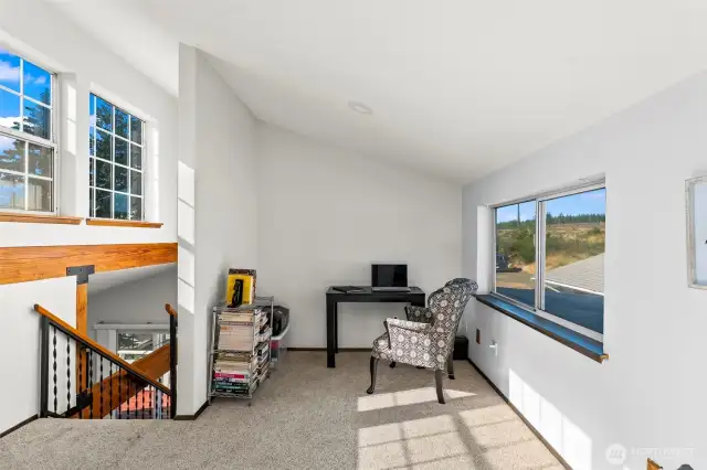 Loft bedroom has additional space, perfect for an office.