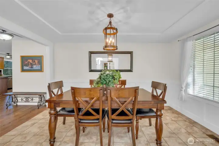 Elegant formal dining room with tray ceiling