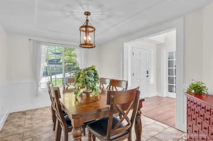 Elegant formal dining room with tray ceiling