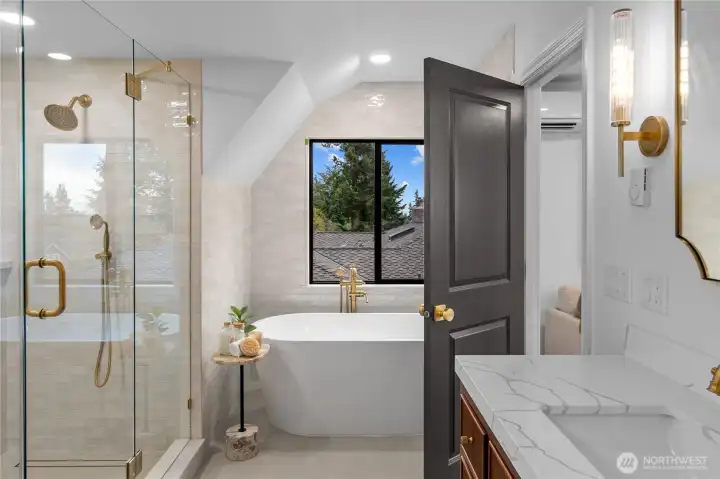 Spa-inspired en suite Primary bath! Ooolala! Featuring a custom double-sink vanity, quartz counters, a luxurious free-standing soaking tub, designer fixtures and premium title.