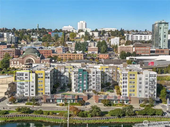 Theas Landing sits overlooking Thea Foss Waterway. The bustling district of Downtown Tacoma sits in its backdrop. The location provides leisure and activities for people of all ages.