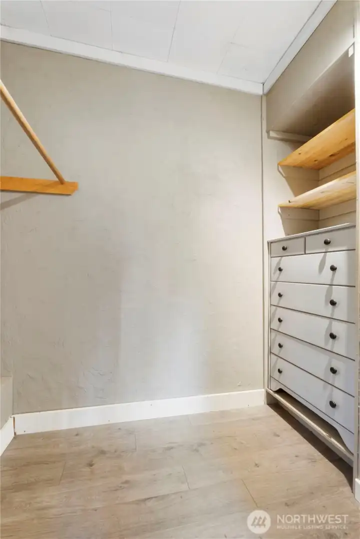 The closet offers practical storage with built-in shelving and hanging space to keep everything organized. Clean lines and thoughtful layout make it functional right away, while still allowing room to customize or expand storage as needed. It’s a straightforward, efficient space that supports everyday living without wasted square footage.