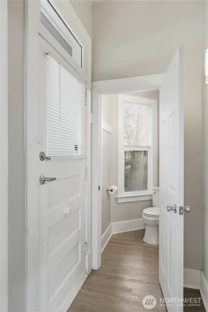 Unit B Front Entry and Half Bathroom.