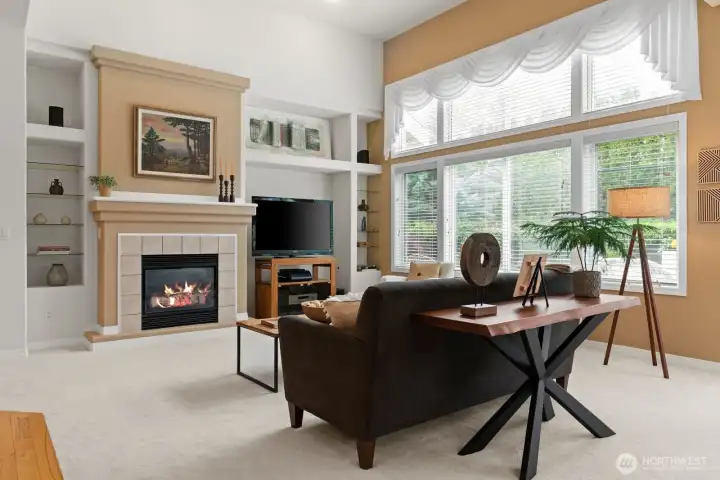 Cozy gas fireplace surrounded with plant ledges and glass shelving, creating a visually stimulating focal point.