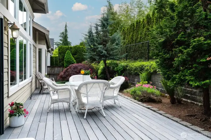 A place for relaxation this manicured, completely fenced backyard provides a private oasis.