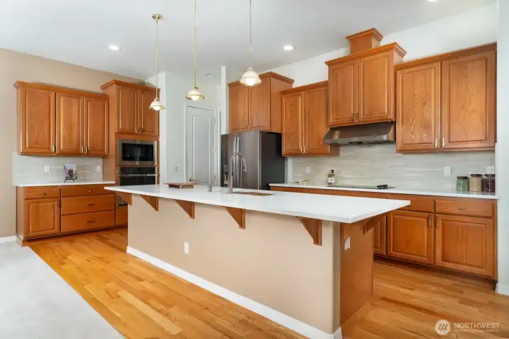 Chef's kitchen with new stainless appliances, provides an abundance of kitchen cabinets and an exceptional amount of counter space.