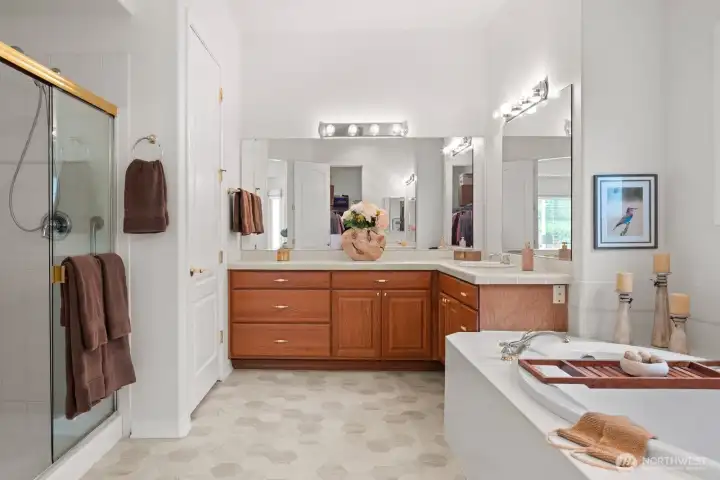 Considerable primary bath with soaking tub, double vanities, shower and private water closet.