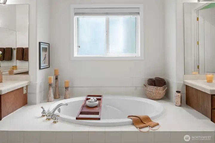 Your own private spa in this roomy primary bath with alluring soaking tub.