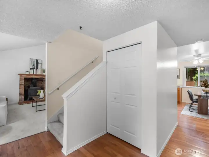 The open, light entry features hardwood floors and guest closet.