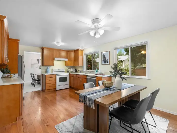 Hardwood floors through the eating space and kitchen.