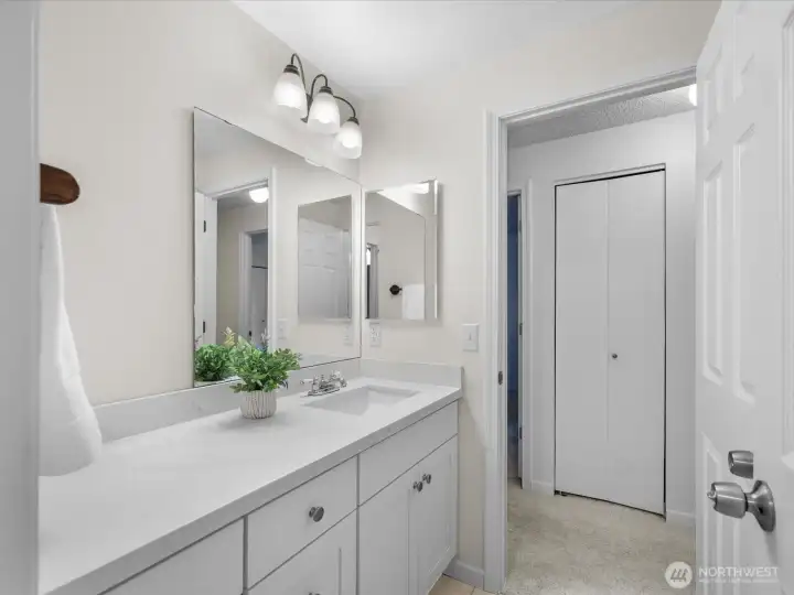 A second large vanity serves the additional three bedrooms on the level.