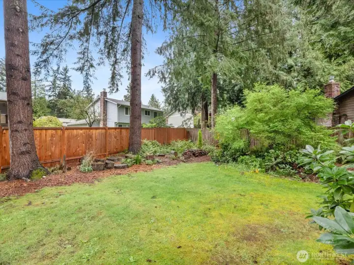The property is landscaped with low maintenance, native trees and shrubbery.