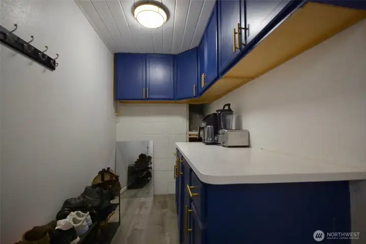 Laundry room fully equipped cabinet with upper and lower and counter top for folding or for your large appliances.