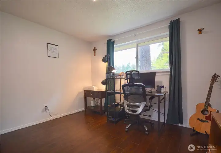 1st bedroom offers laminate wood floors, closet organizer.