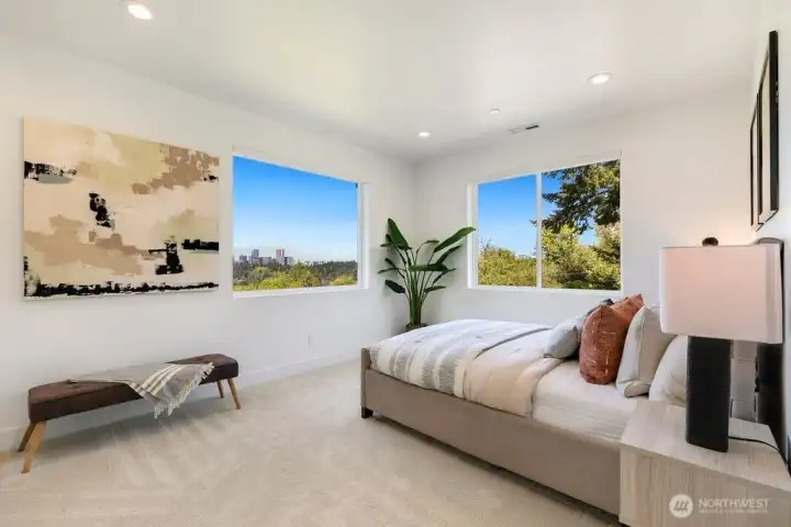 Wake up each morning to breathtaking city skyline views from the comfort of the luxurious primary suite