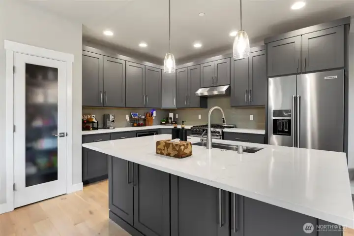 Beautful kitchen with large pantry and center island.  All stainless steel appliances stay.
