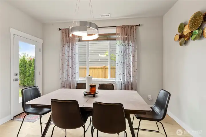 Dedicated dining area with door leading to the patio and backyard.