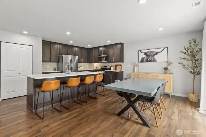 Center quartz island with comfortable space for at least 4 barstools. Convenient outlet on center island as well. Center quartz island with comfortable space for at least 4 barstools. Convenient outlet on center island as well.