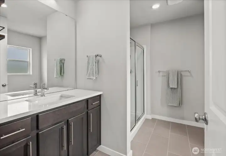 Nice ensuite bathroom off Primary suite. Quartz countertops. Nice ensuite bathroom off Primary suite. Quartz countertops.