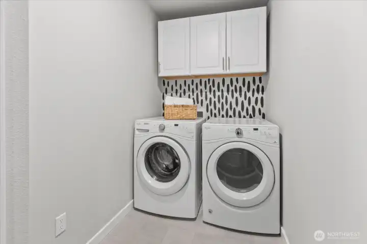 Nice size laundry room with door that shuts. Front load washer and dryer are included! Handy cabinet space above and fun accent wall. Nice size laundry room with door that shuts. Front load washer and dryer are included! Handy cabinet space above and fun accent wall.