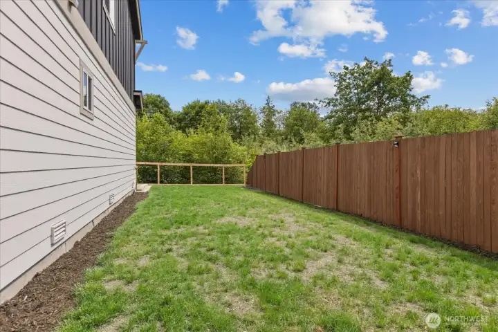 Another view of the very large side yard and greenbelt. Immediate access from back patio. Another view of the very large side yard and greenbelt. Immediate access from back patio.