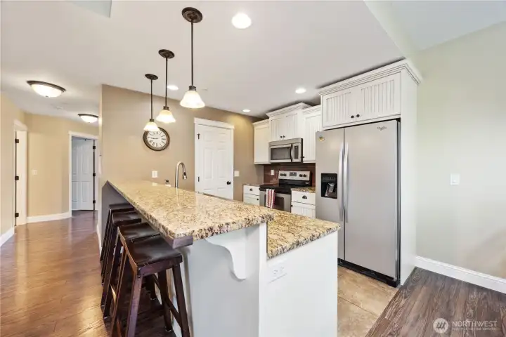 2nd floor kitchen with bar seating 2nd floor kitchen with bar seating