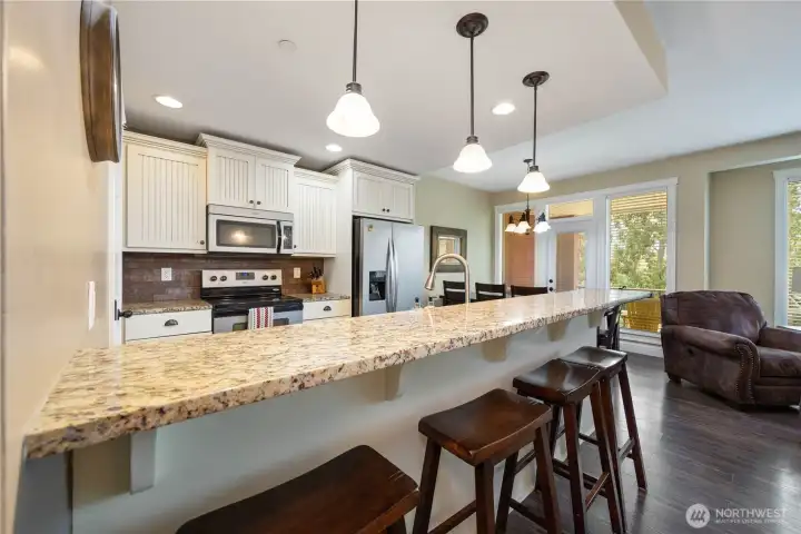 2nd floor kitchen with bar seating 2nd floor kitchen with bar seating