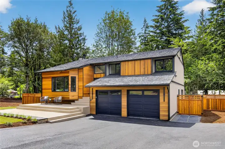 Northwest contemporary style with modern Craftsman influence gives this home a striking first impression, with warm wood siding, strong horizontal lines, dark-framed windows, broad roof planes, clean trim, and a natural setting that feels distinctly Pacific Northwest. The garage doors are new, along with new garage door openers and remotes, and the inside of the garage has been sheet-rocked and finished, and a EV electric car charger has been installed! Northwest contemporary style with modern Craftsman influence gives this home a striking first impression, with warm wood siding, strong horizontal lines, dark-framed windows, broad roof planes, clean trim, and a natural setting that feels distinctly Pacific Northwest. The garage doors are new, along with new garage door openers and remotes, and the inside of the garage has been sheet-rocked and finished, and a EV electric car charger has been installed!