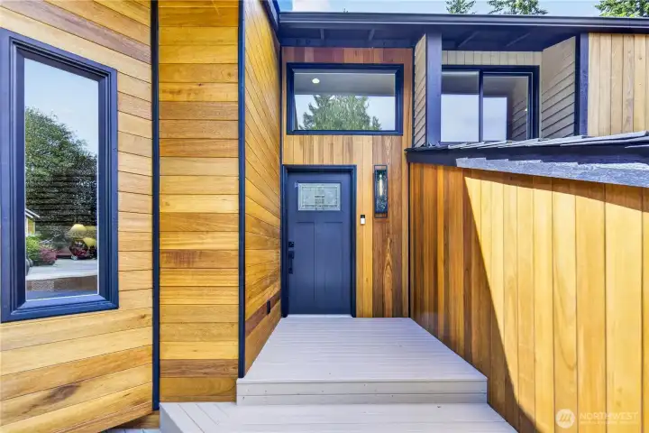 Refreshed front siding and black trim bring out the home’s Pacific Northwest style, while the new front door adds a polished modern touch with its Craftsman-style panels and decorative glass inset. A tall caged lantern sconce with textured glass and an Edison bulb adds a clean contemporary accent. All exterior doors are new, and one matching key opens them all for everyday convenience. Refreshed front siding and black trim bring out the home’s Pacific Northwest style, while the new front door adds a polished modern touch with its Craftsman-style panels and decorative glass inset. A tall caged lantern sconce with textured glass and an Edison bulb adds a clean contemporary accent. All exterior doors are new, and one matching key opens them all for everyday convenience.