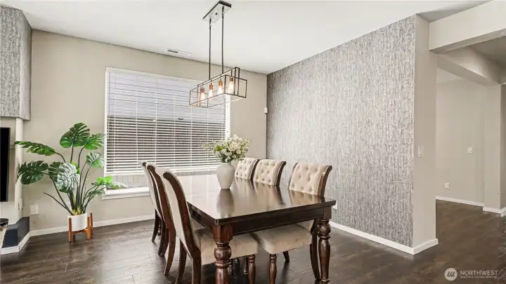 Open dining room with stylish lighting fixture. Open dining room with stylish lighting fixture.