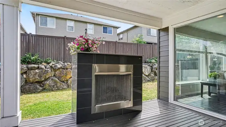 The large sliding door fills the space with natural light and opens to the covered deck with fireplace for seamless indoor-outdoor living. The large sliding door fills the space with natural light and opens to the covered deck with fireplace for seamless indoor-outdoor living.