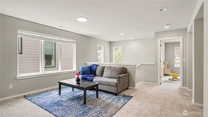 A second living room upstairs offers endless possibilities as a playroom, media room, or additional gathering space. A second living room upstairs offers endless possibilities as a playroom, media room, or additional gathering space.