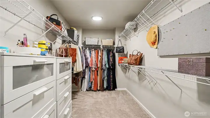 Expansive secondary walk-in closet in the primary suite provides abundant storage and organization. Expansive secondary walk-in closet in the primary suite provides abundant storage and organization.