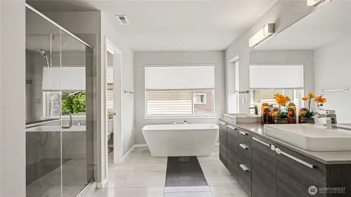 Luxurious spa-inspired five-piece en-suite bath offering a serene retreat. Luxurious spa-inspired five-piece en-suite bath offering a serene retreat.