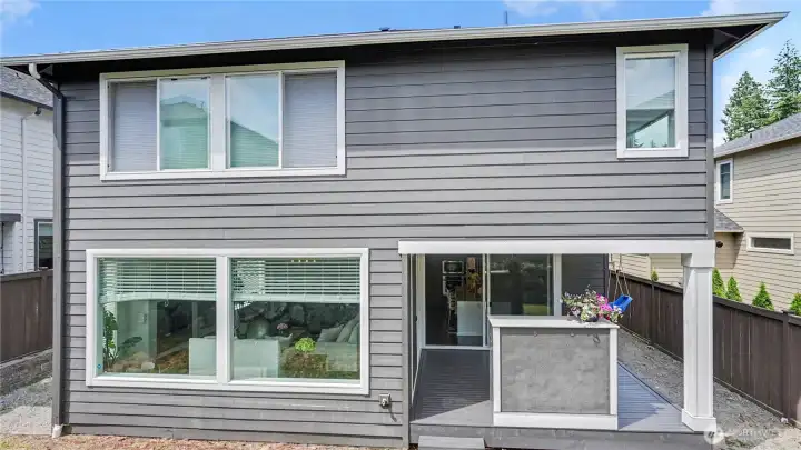 Outside, enjoy a low-maintenance backyard & covered deck with fireplace, perfect for year-round entertaining. Outside, enjoy a low-maintenance backyard & covered deck with fireplace, perfect for year-round entertaining.