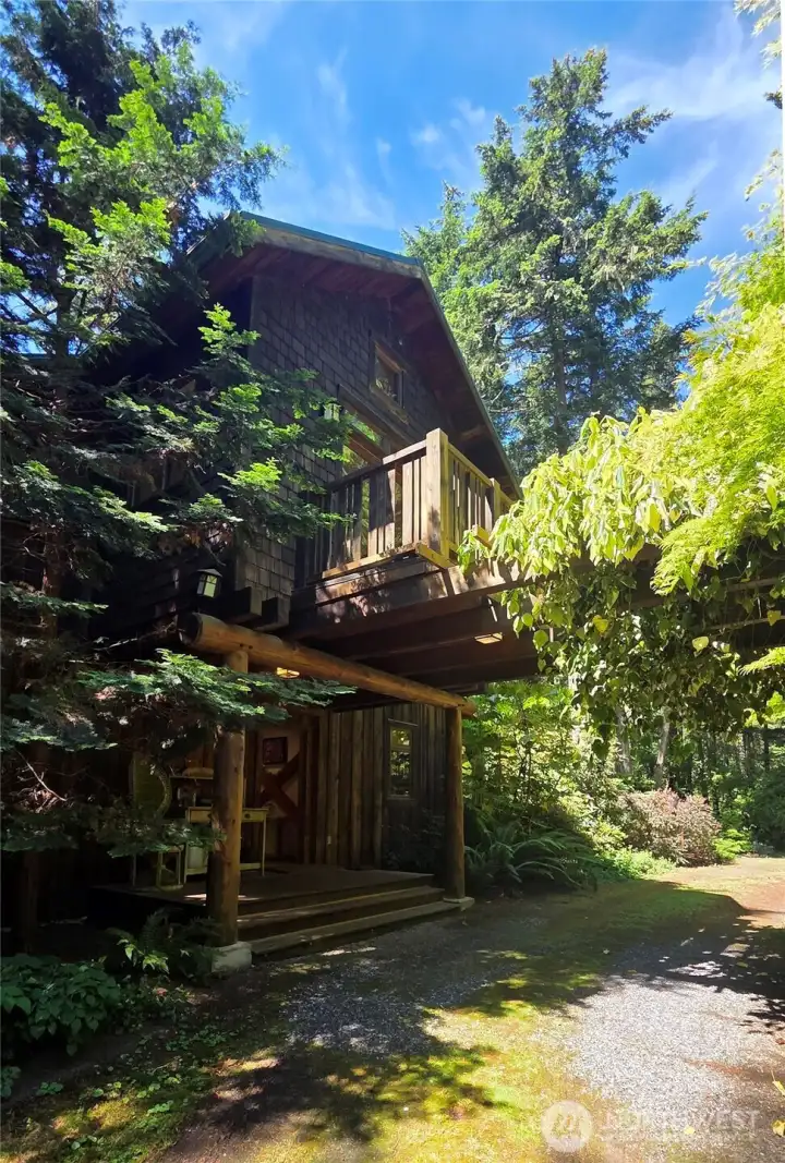 Arbor over front entrance and upstairs bedroom deck Arbor over front entrance and upstairs bedroom deck