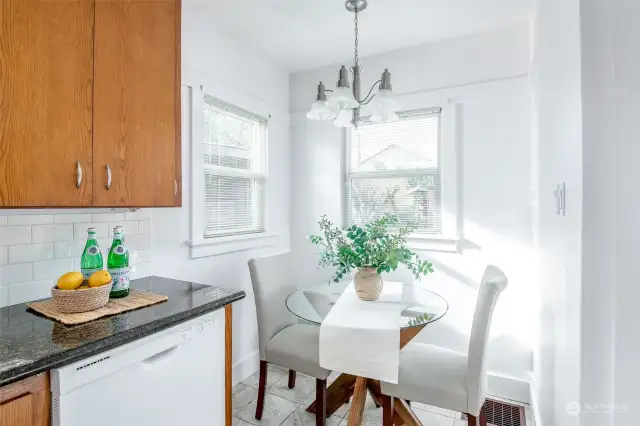 Enjoy this eating space next to big windows overlooking the back yard.