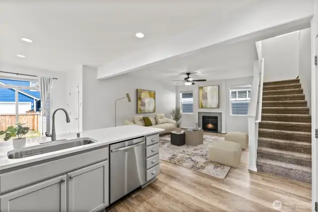 Virtually staged living space off of kitchen