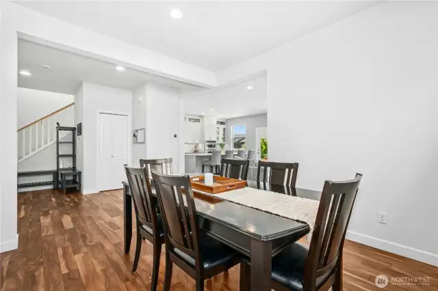 Dining room with engineered hardwood flooring.