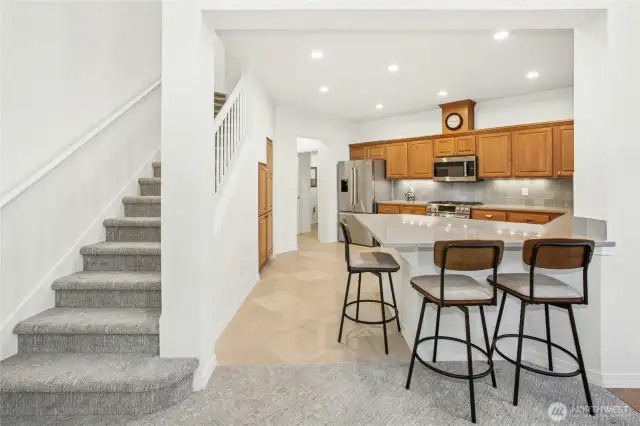 An additional view of the kitchen showcasing the quartz countertops