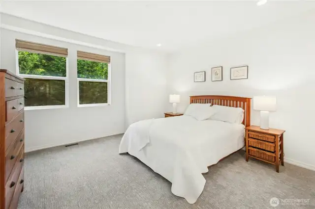 The premiere suite is conveniently located on the main level with views to the greenspace