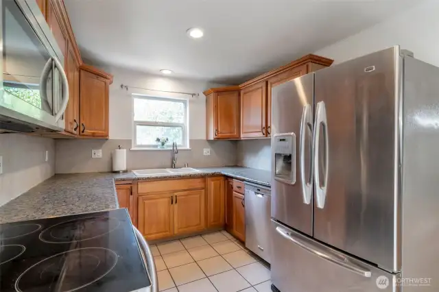 Main kitchen with SS appliances and granite countertops
