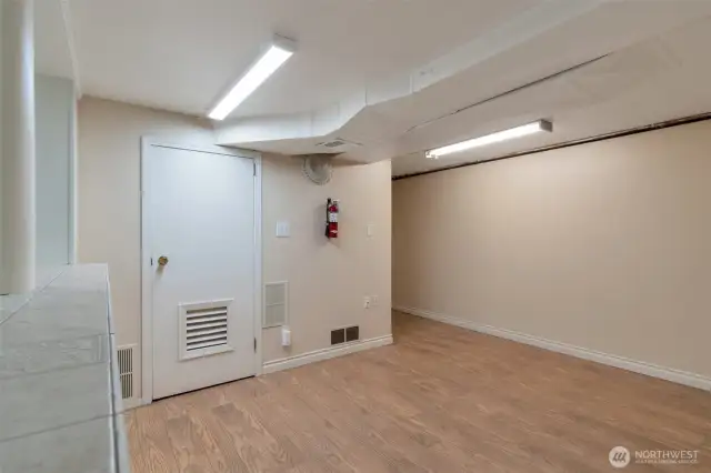 Mechanical room downstairs with newer forced air and water heaters units