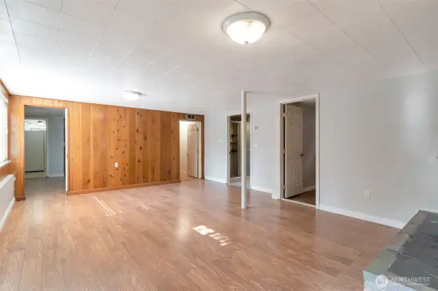 Great room downstairs with cozy wood fireplace