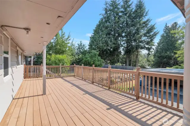 Expansive trex deck to the back of the house with covered area
