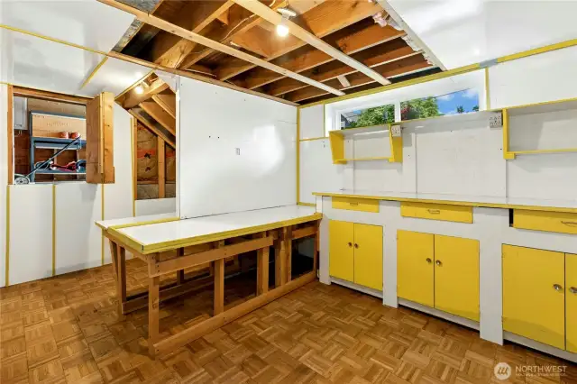 Hobby Room in basement with hatch to the garage.